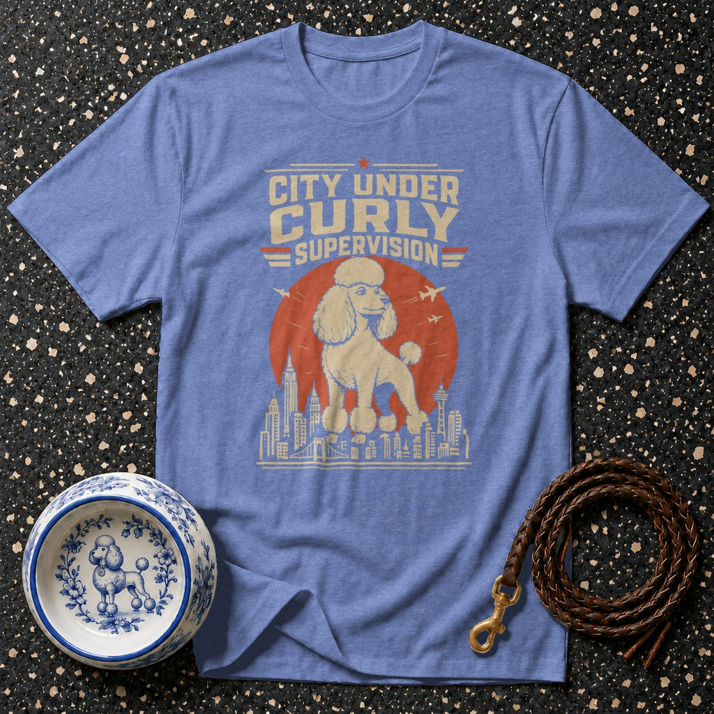 Blue t-shirt with "City Under Curly Supervision" and a poodle graphic.