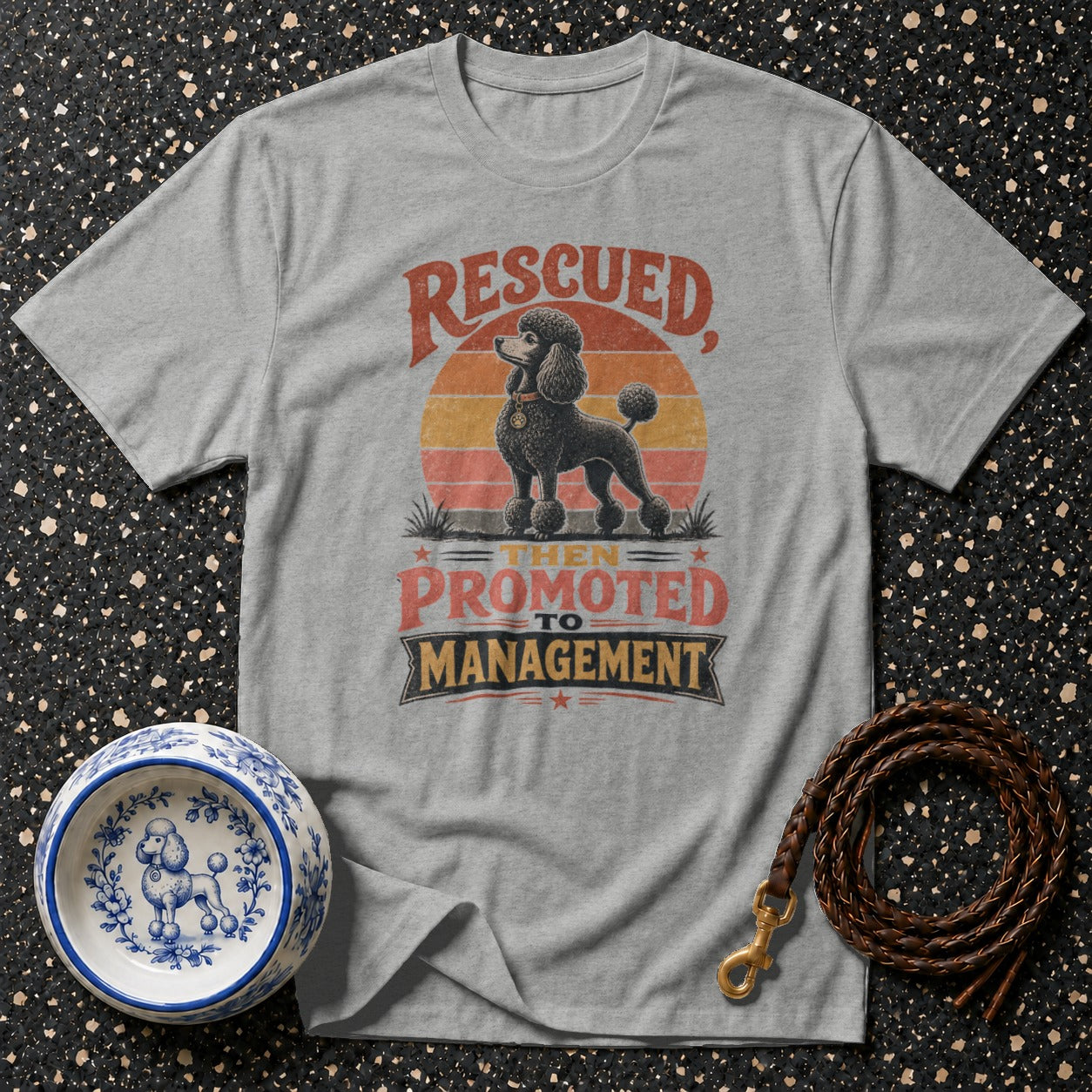 Grey t-shirt with a black poodle graphic and text "RESCUED, THEN PROMOTED TO MANAGEMENT".
