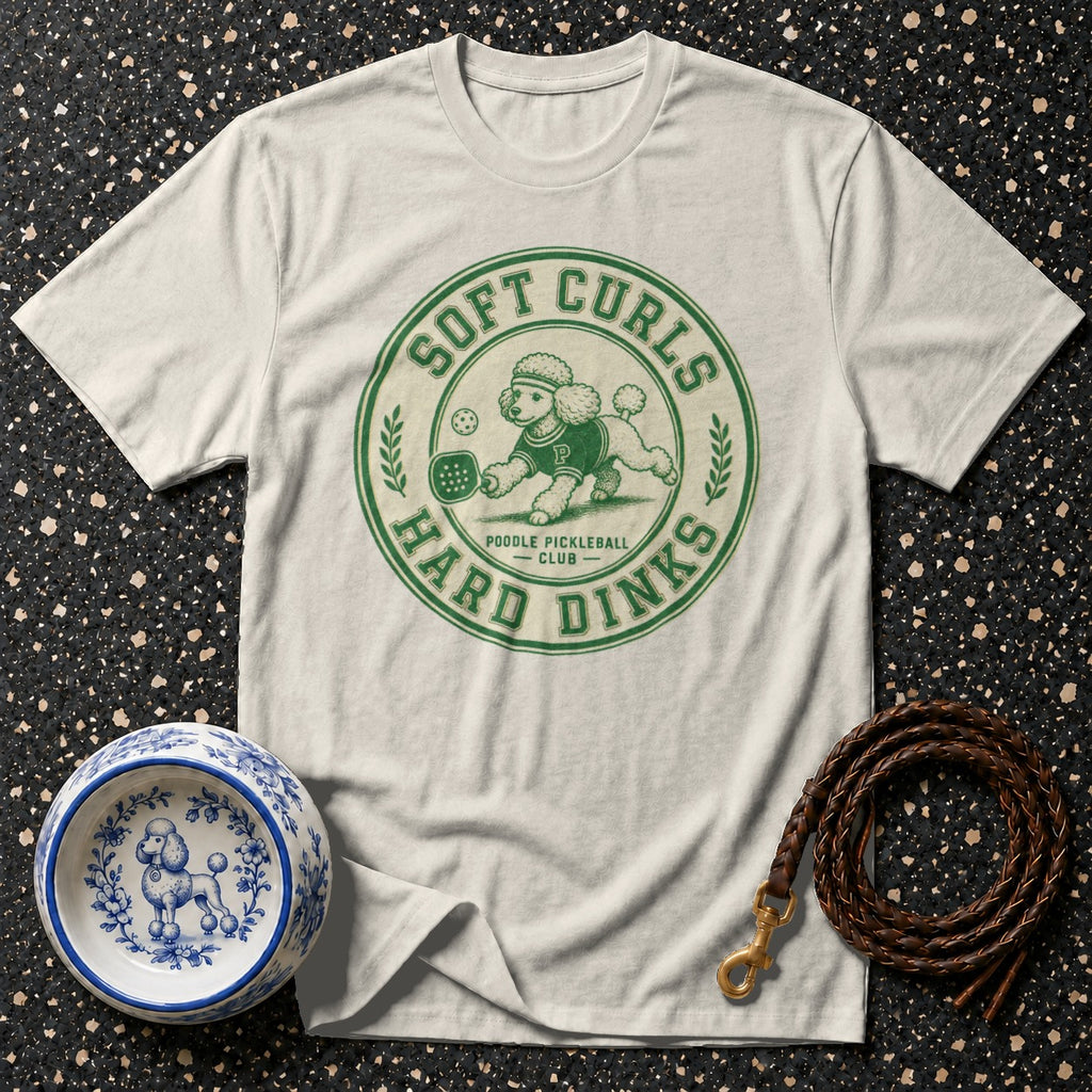 Cream t-shirt with green "Soft Curls Hard Dinks Poodle Pickleball Club" graphic.