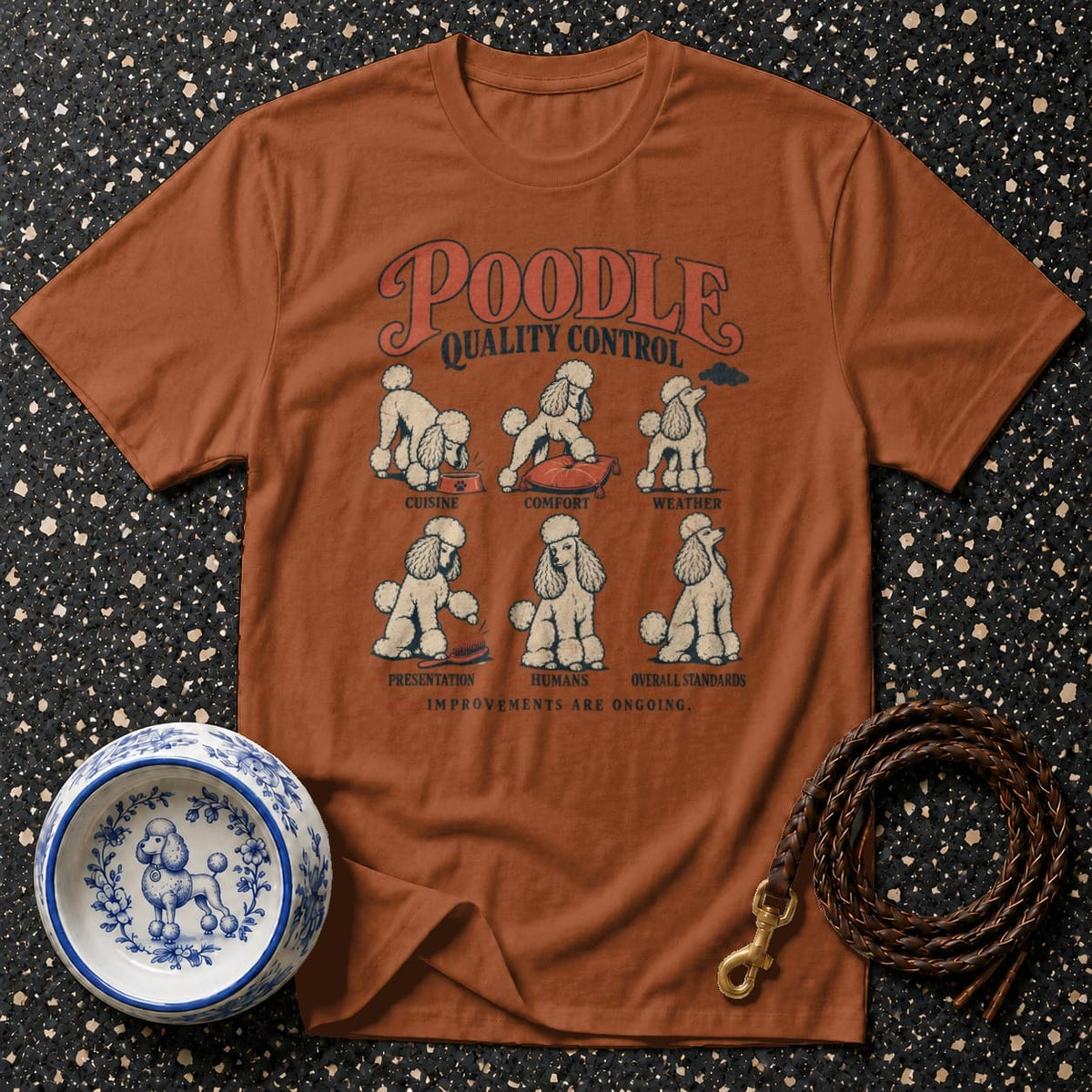 Brown t-shirt with "Poodle Quality Control" and six illustrations of poodles.