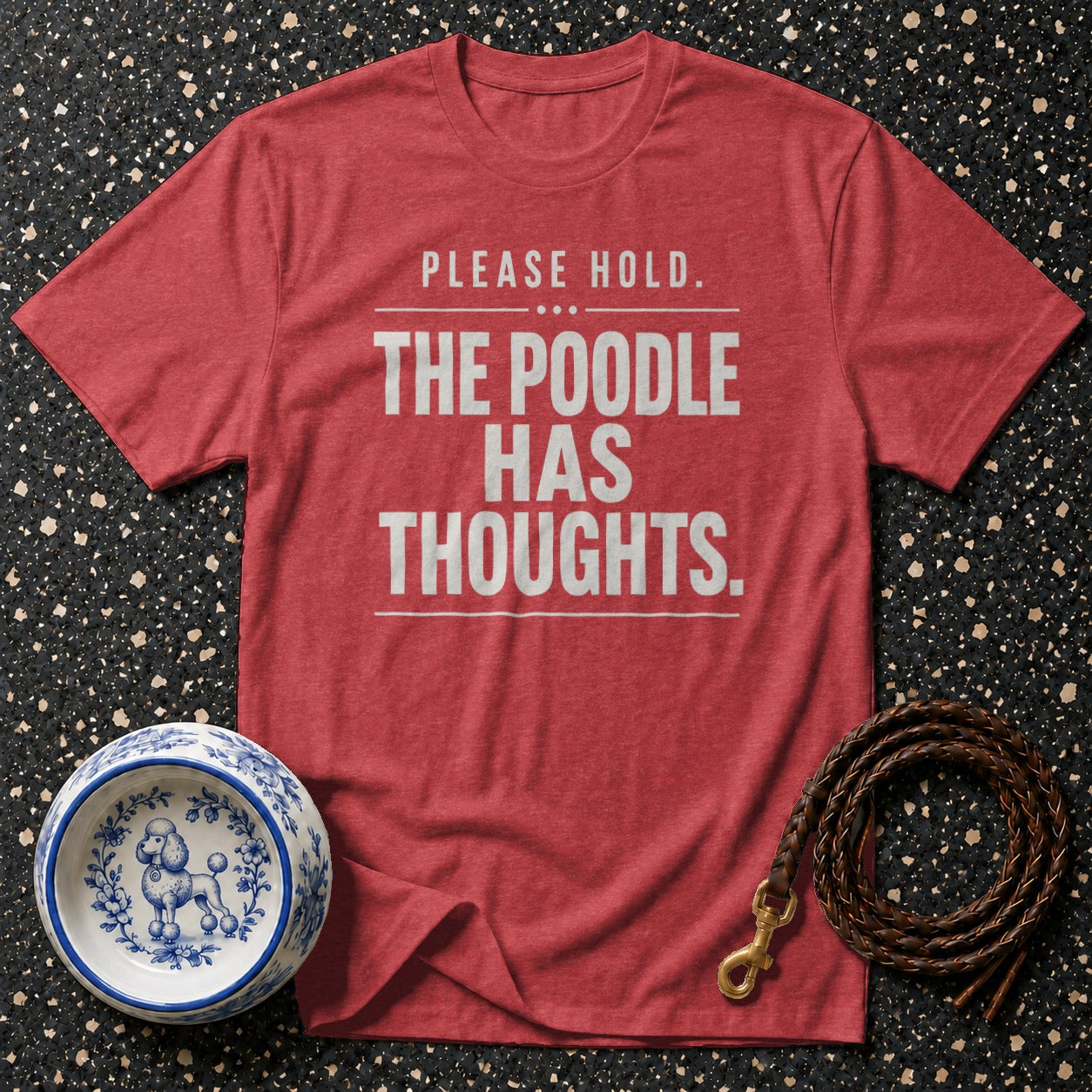 Red t-shirt with "Please Hold. The Poodle Has Thoughts." text, dog bowl, and leash.