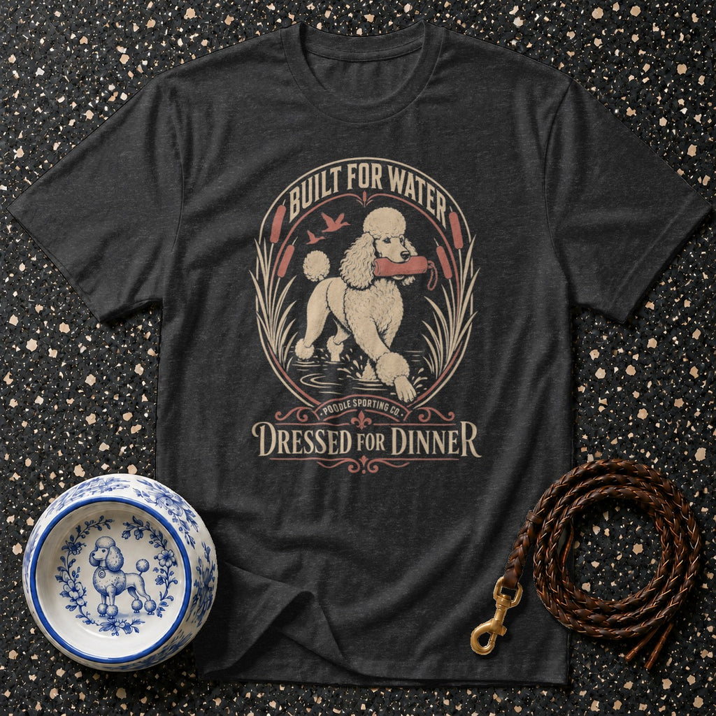 Dark gray t-shirt with a graphic of a poodle in water holding a stick.