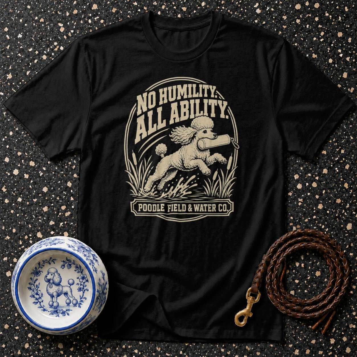 Black t-shirt with a poodle running in water, text "No Humility, All Ability".