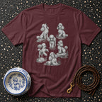 Maroon t-shirt with multiple poodle sketches and a decorative poodle bowl.