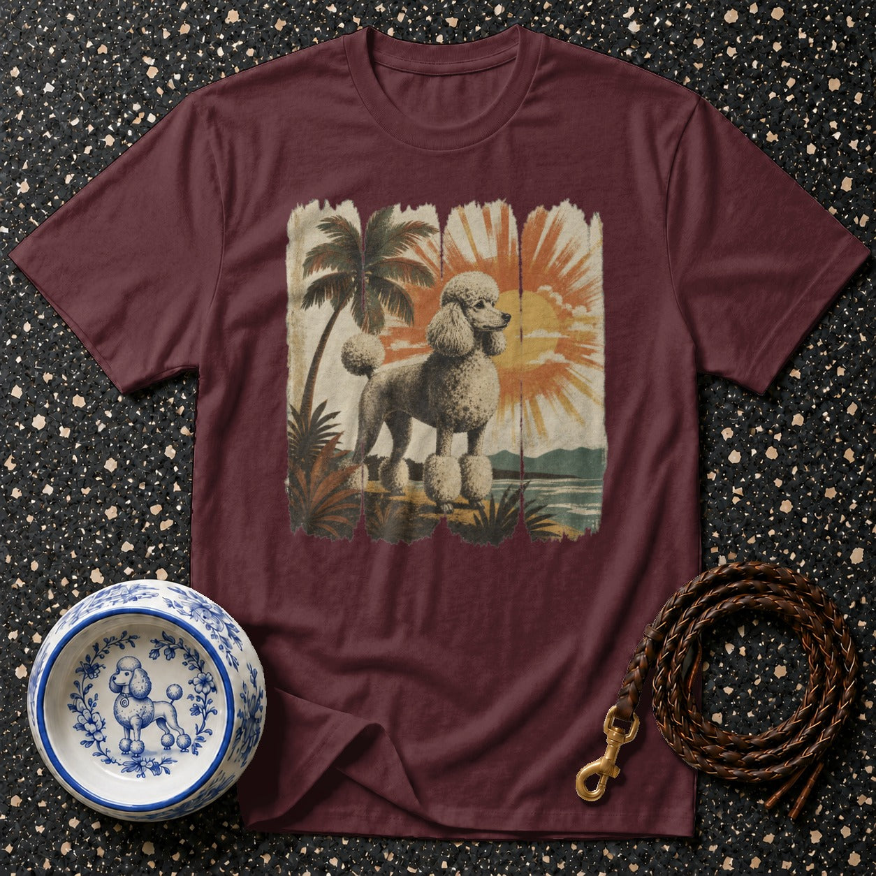 Maroon t-shirt with vintage poodle and tropical sunset graphic.