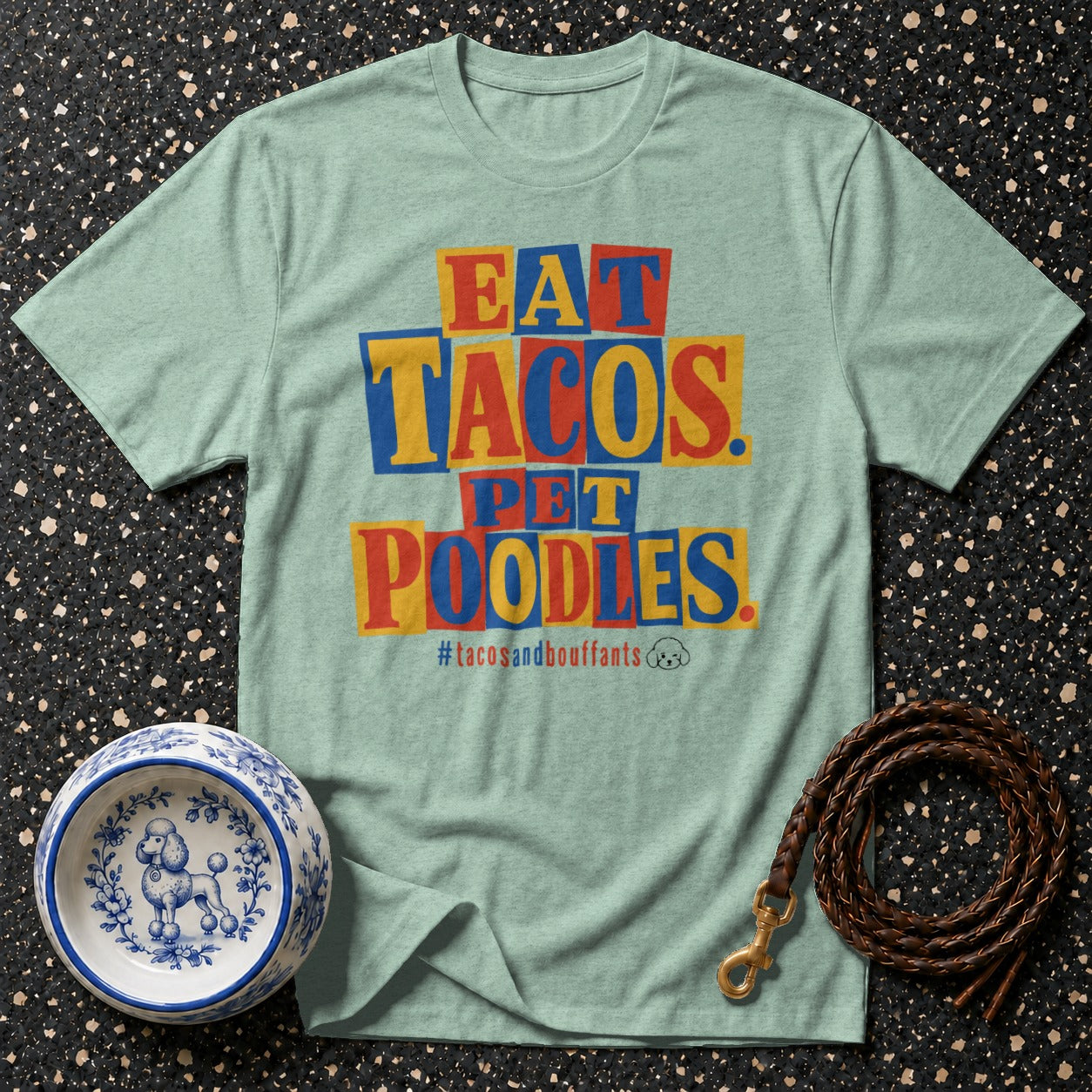 Light green t-shirt with "EAT TACOS. PET POODLES." text and poodle dog bowl.