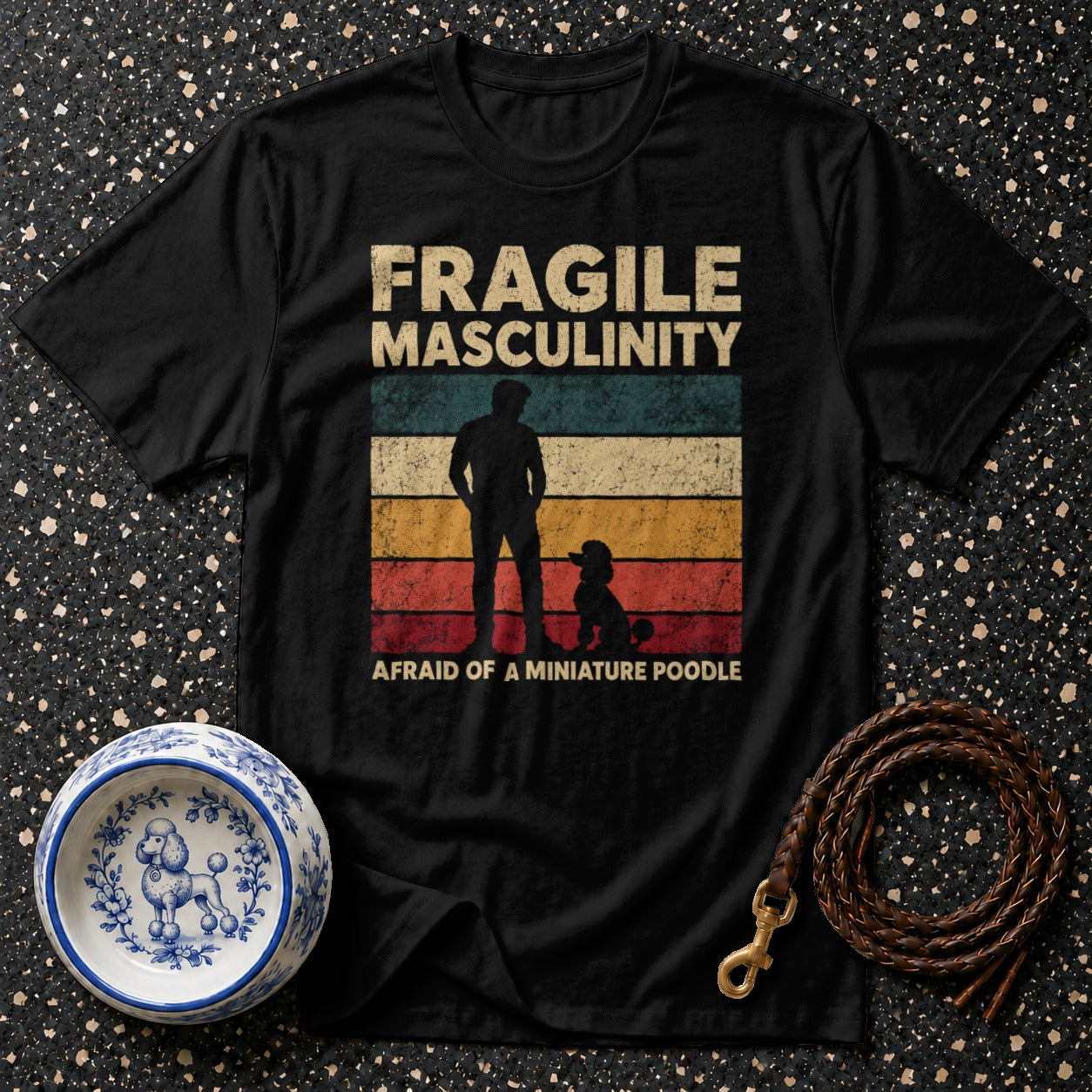 Black t-shirt with "Fragile Masculinity" and poodle graphic.