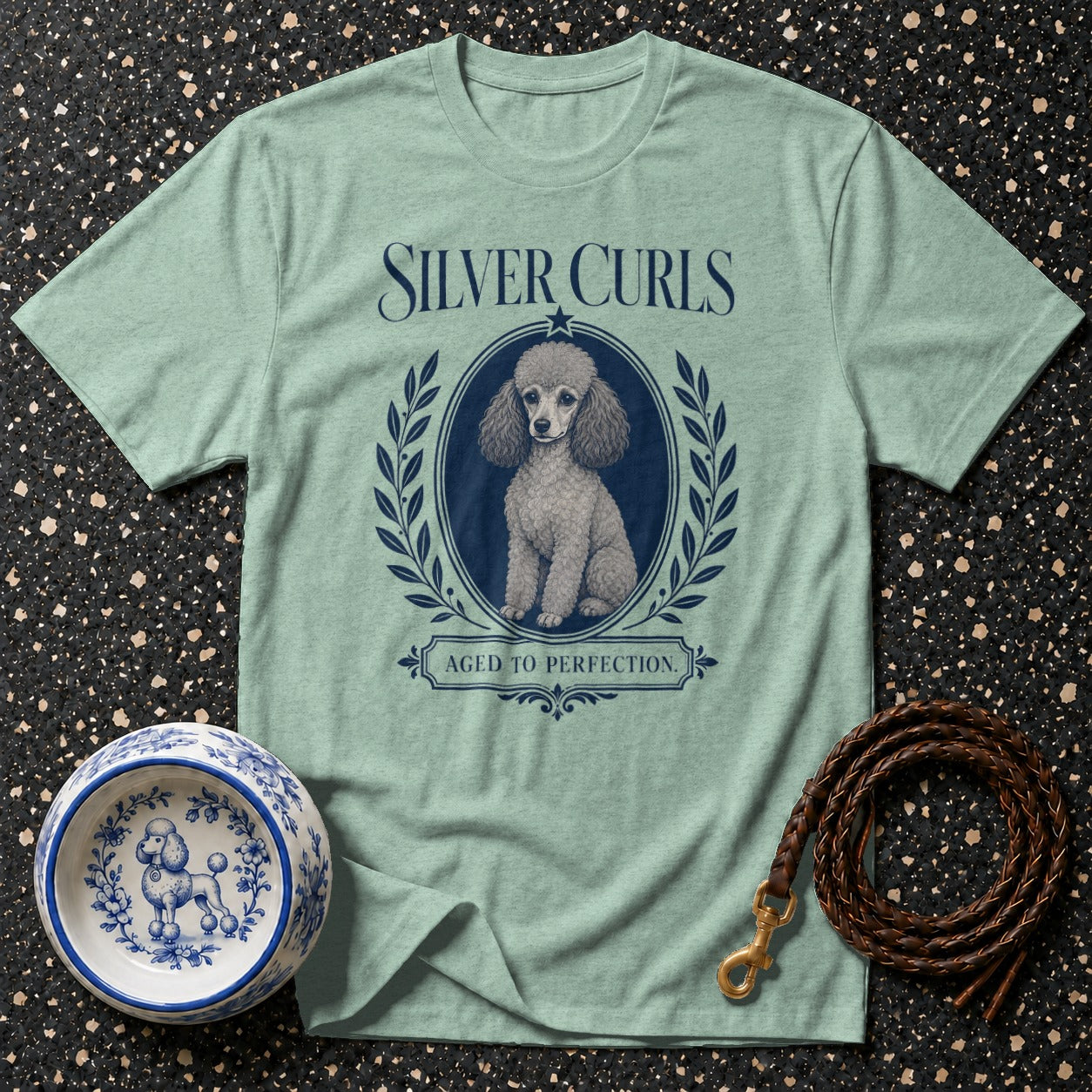 Light green t-shirt with silver poodle illustration and text "Silver Curls Aged to Perfection."