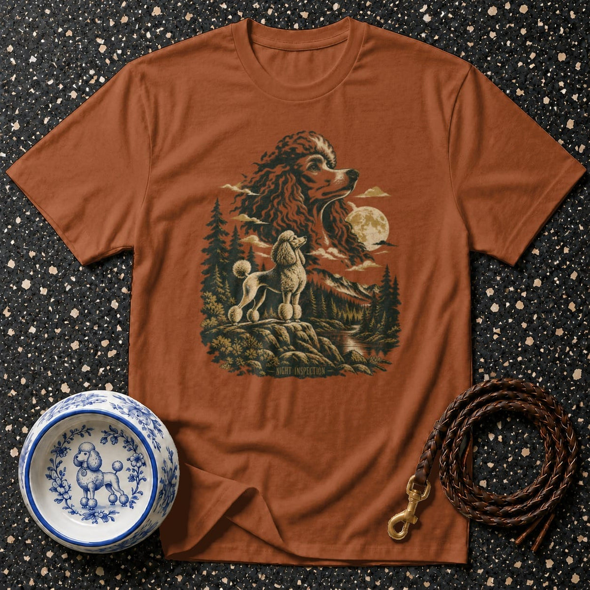 T-shirt with a vintage graphic of two poodles in a forest scene under a full moon.