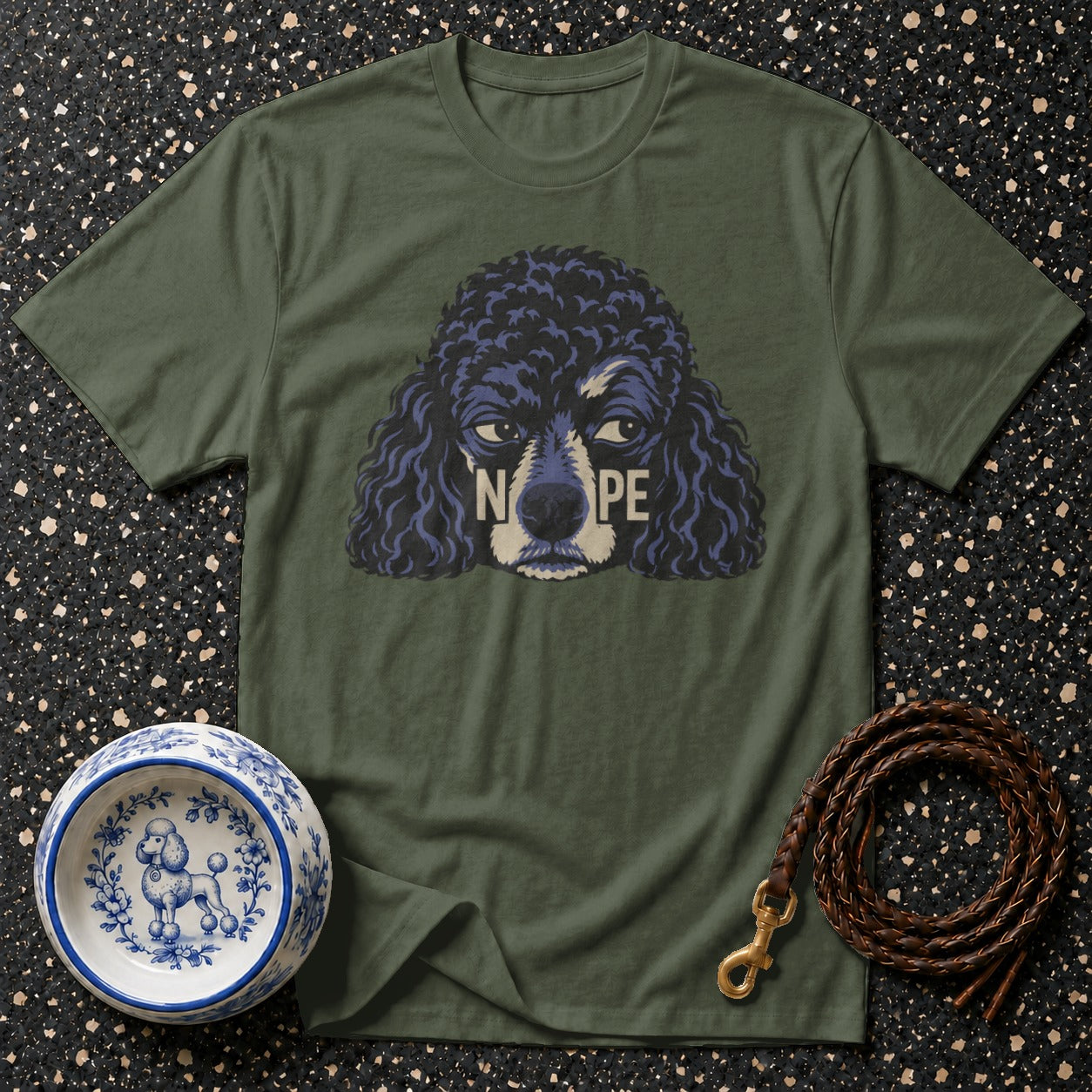 Green t-shirt with a poodle graphic and the word "NOPE" across its face.