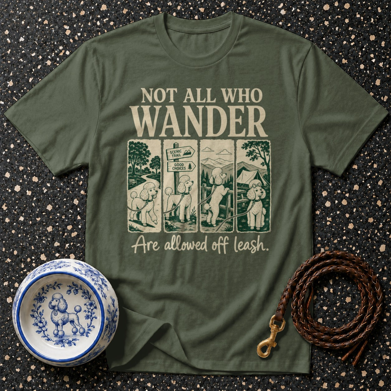 Green t-shirt with "Not All Who Wander" text and poodle illustrations.