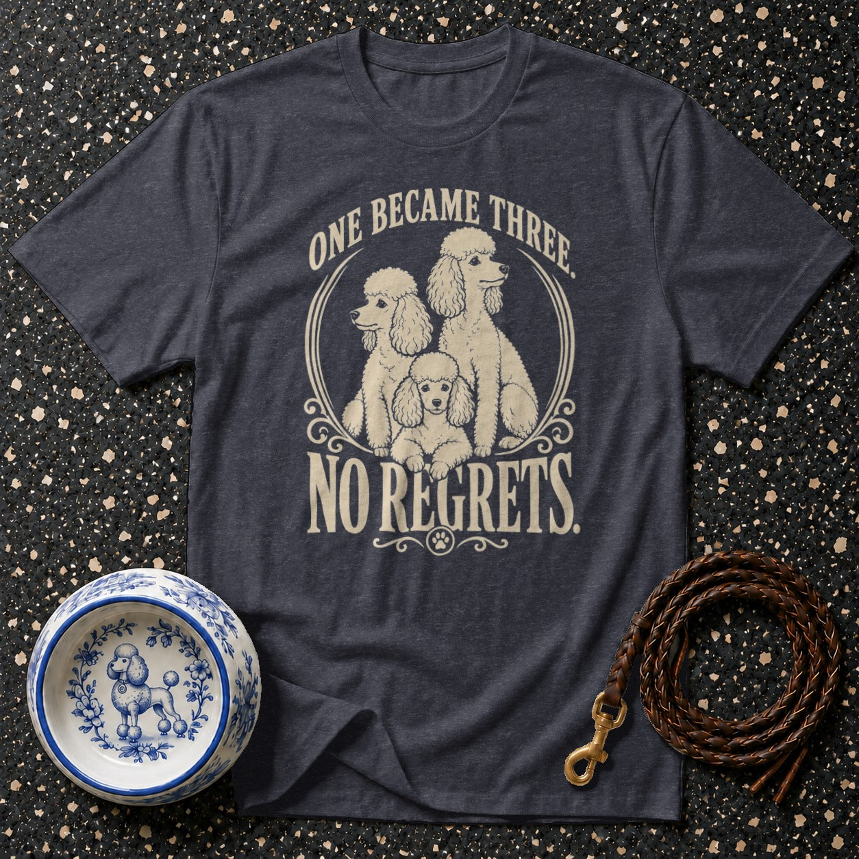 Dark grey t-shirt with three poodles and text: One became three. No regrets.
