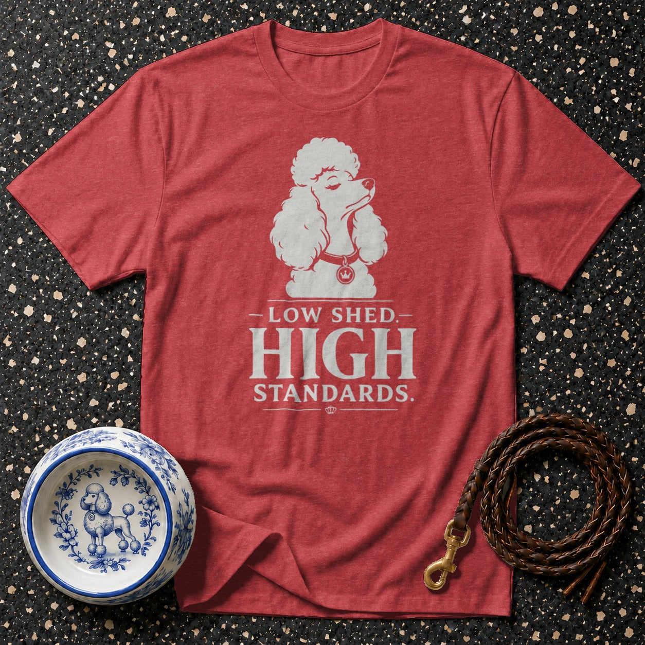 Red t-shirt with white poodle graphic and text "LOW SHED. HIGH STANDARDS."