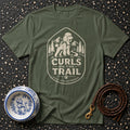 Olive green t-shirt with poodle hiking graphic and text "Curls on the Trail."