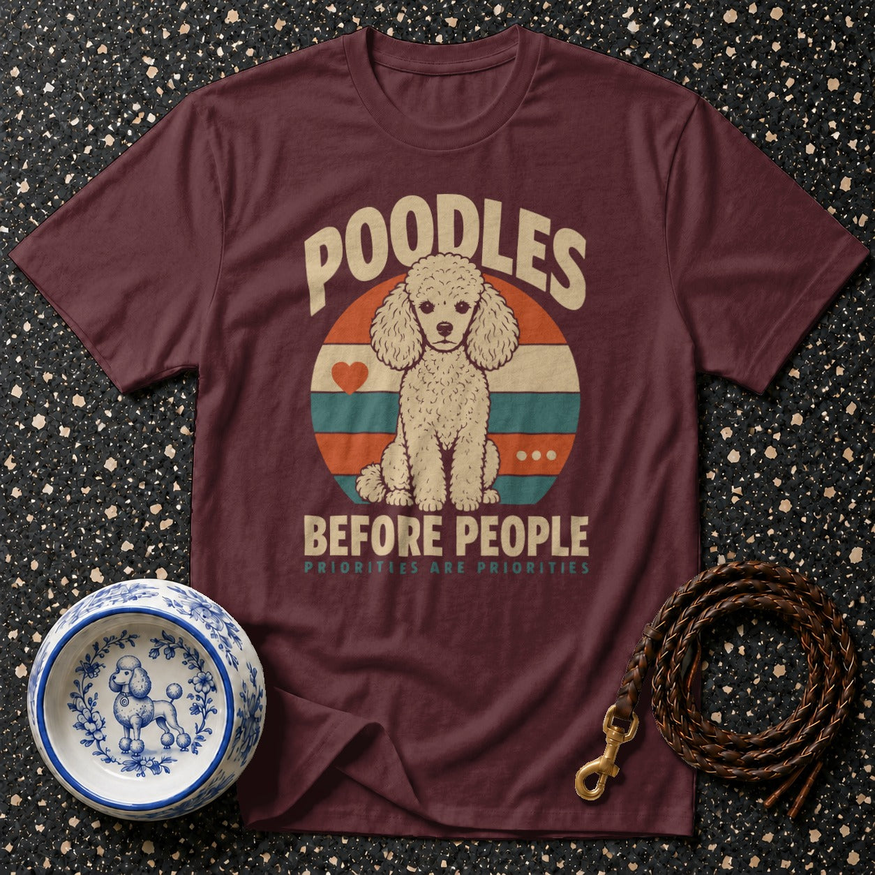 Maroon t-shirt with "Poodles Before People" graphic and poodle illustration.