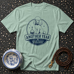 Mint t-shirt with navy graphic of a poodle and text: "Another Year Under Poodle Management."