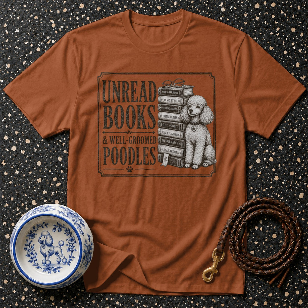 T-shirt graphic with text "Unread Books & Well-Groomed Poodles", books, and poodle.