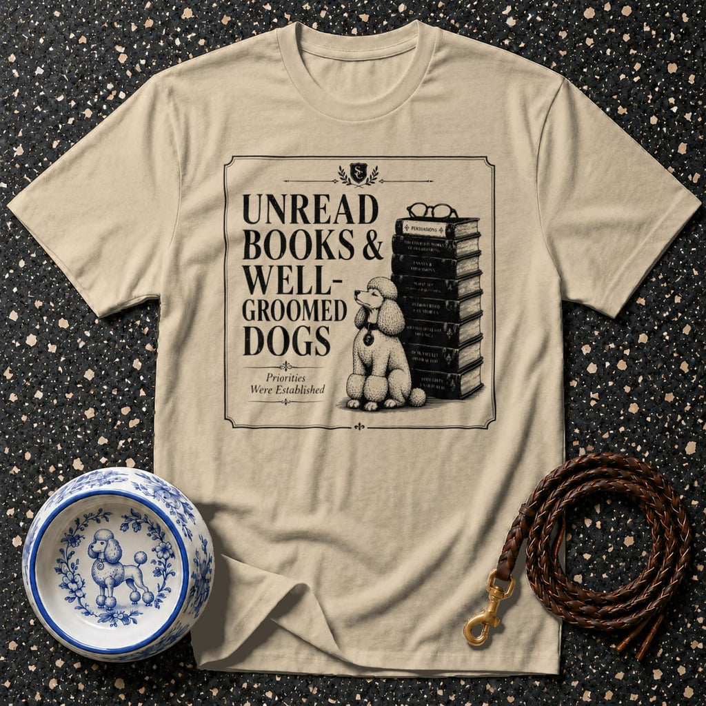 T-shirt graphic reads "Unread Books & Well-Groomed Dogs" with a poodle beside books.