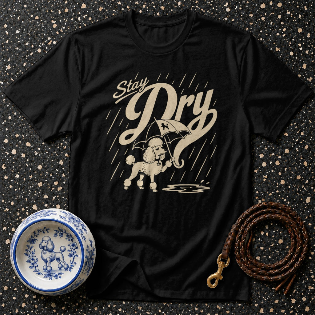 Black t-shirt with a poodle under an umbrella, text "Stay Dry", and rain.