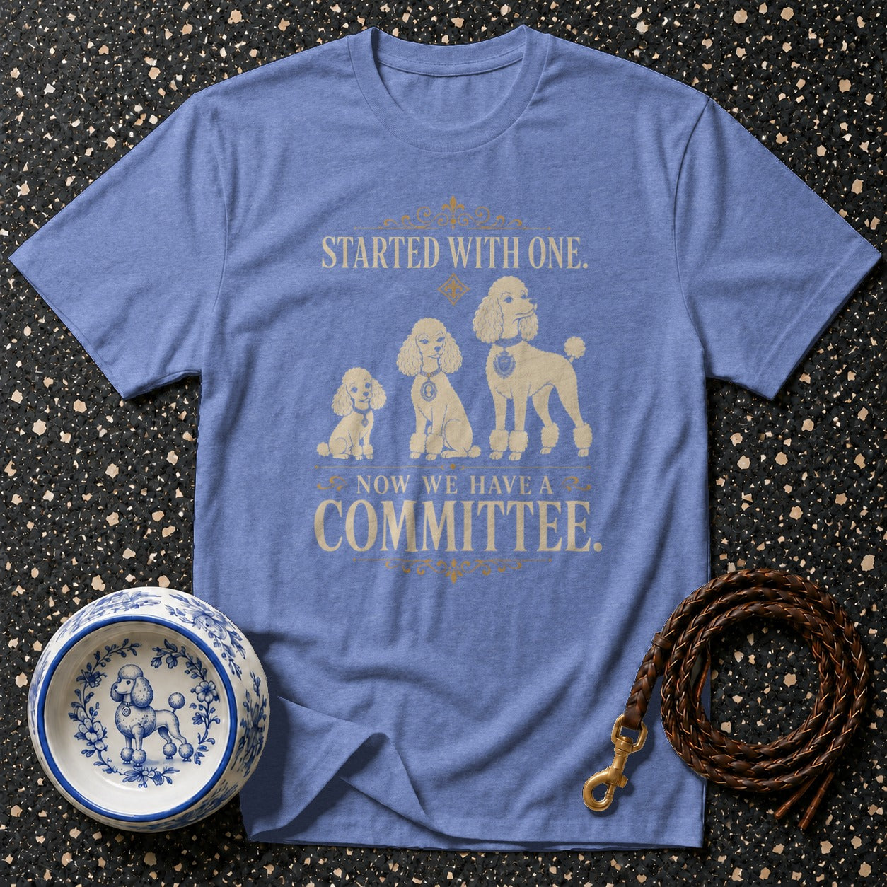 Blue t-shirt with three poodles and text "STARTED WITH ONE. NOW WE HAVE A COMMITTEE."