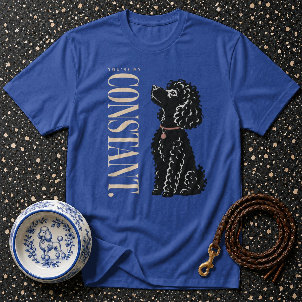 Blue t-shirt with a black poodle illustration and text "YOU'RE MY CONSTANT."