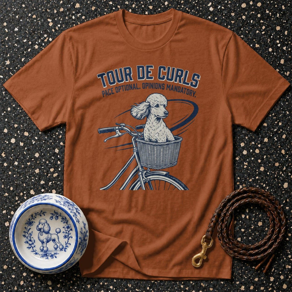 T-shirt with dog riding bicycle graphic and text "Tour De Curls".