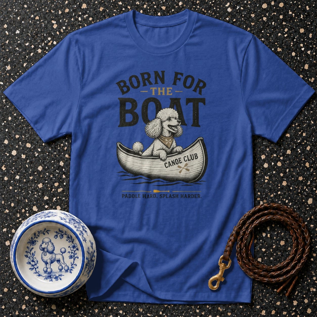 Royal blue t-shirt with a poodle in a canoe graphic and text.