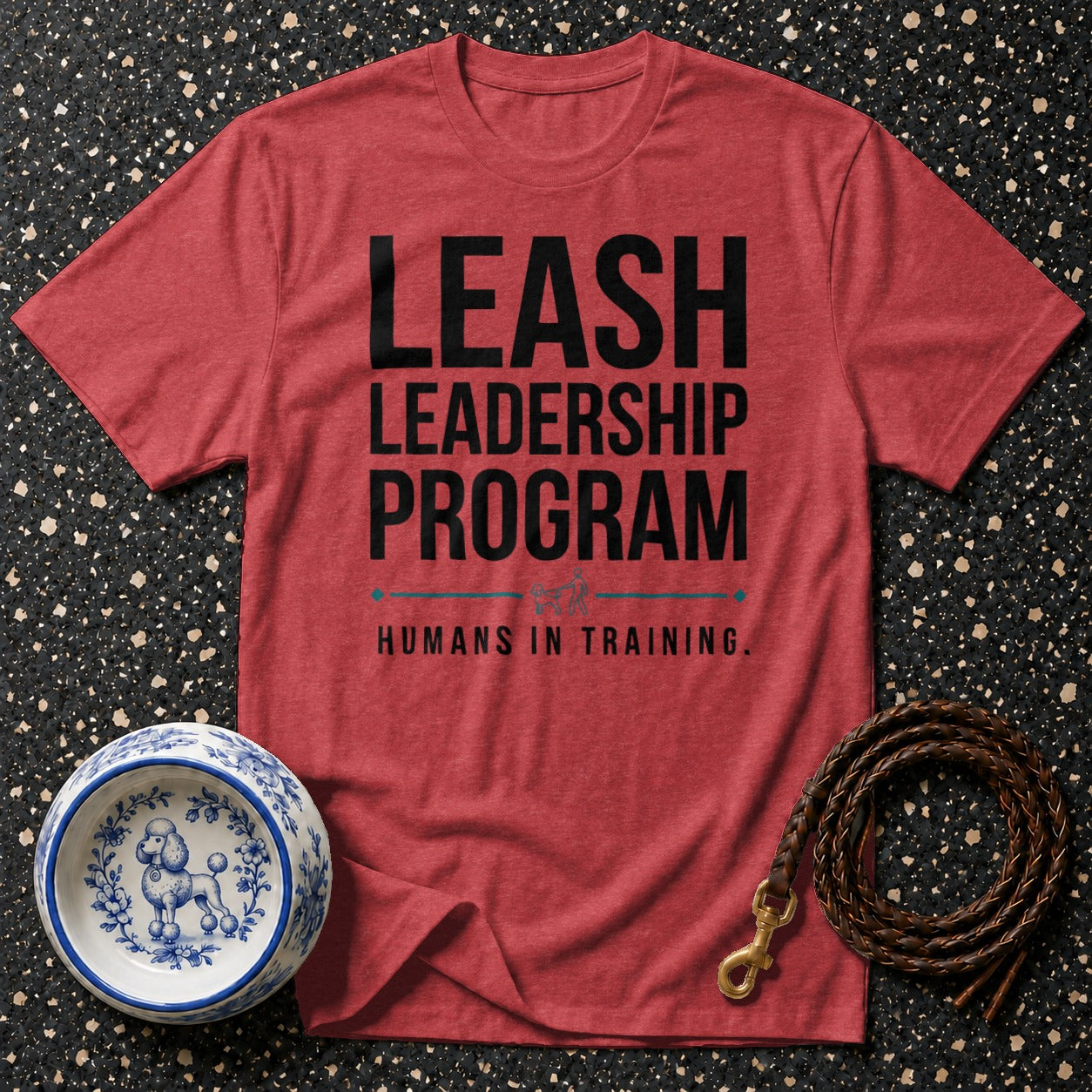 Red t-shirt with "LEASH LEADERSHIP PROGRAM HUMANS IN TRAINING" text.
