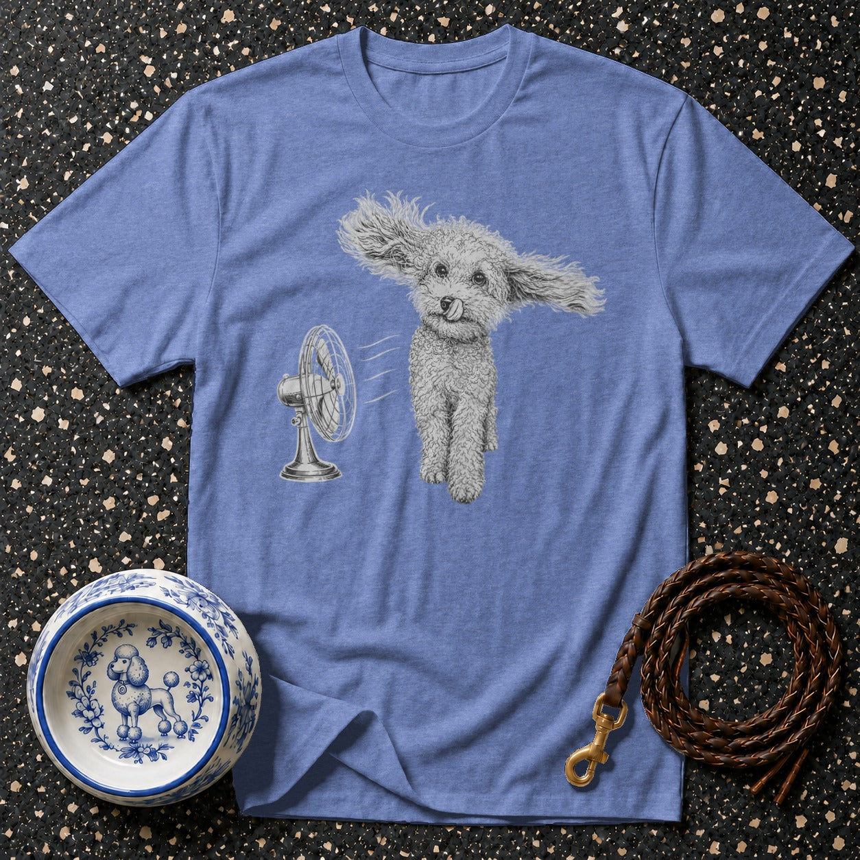 T-shirt with a fluffy dog with ears flying in the wind from a fan.