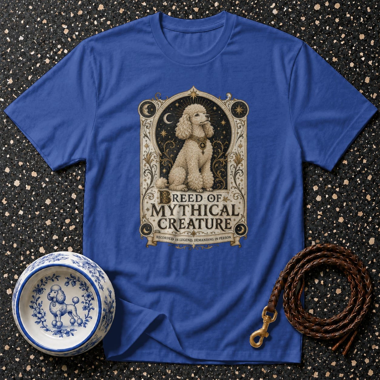 Royal blue t-shirt with a white poodle graphic and text "BREED OF MYTHICAL CREATURE".