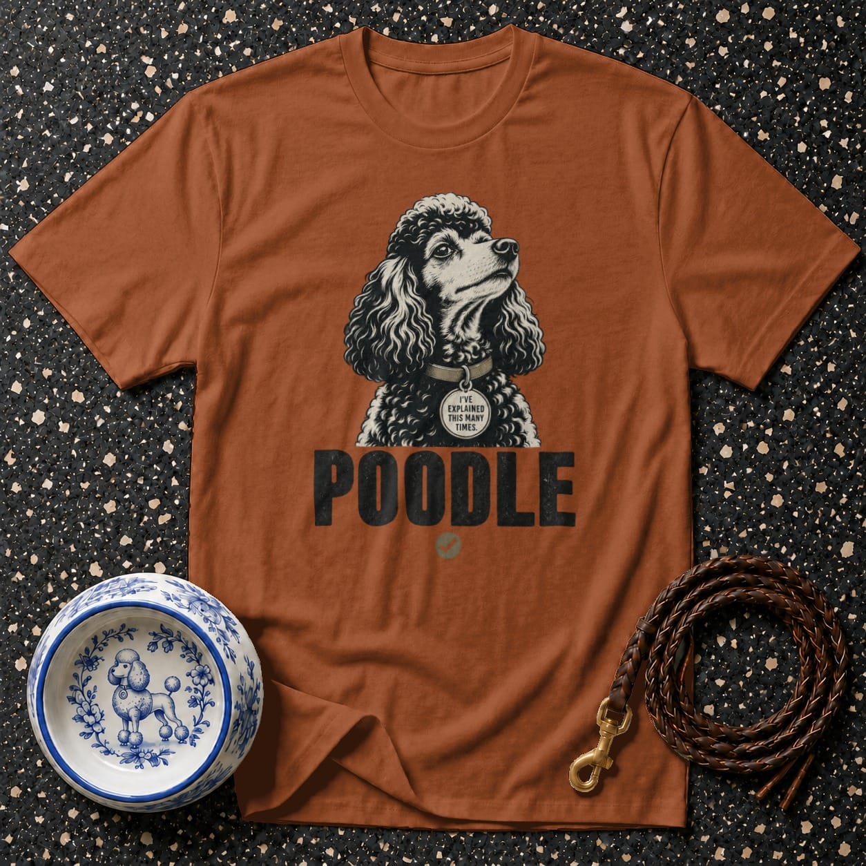 T-shirt with a poodle graphic and "POODLE" text. Includes dog bowl and leash.