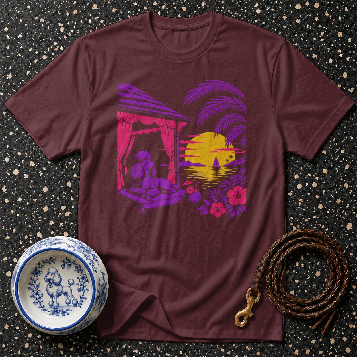 Maroon t-shirt with poodle relaxing in tropical sunset scene graphic.