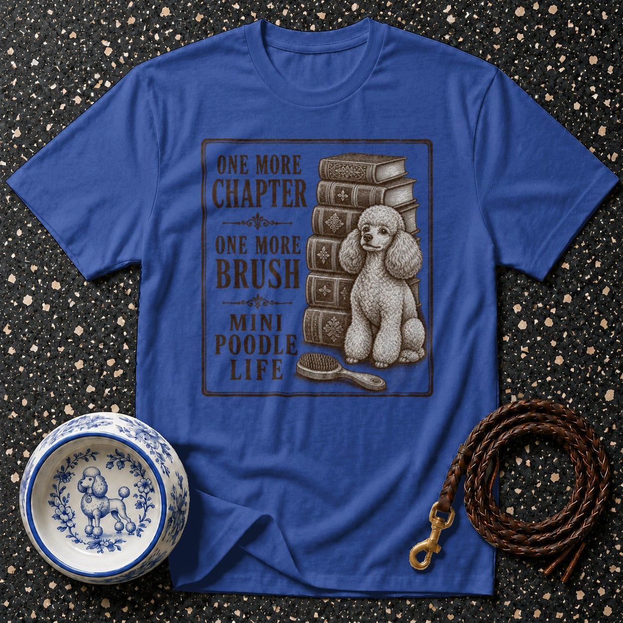 Blue t-shirt with "One More Chapter, One More Brush, Mini Poodle Life" text and poodle graphic.
