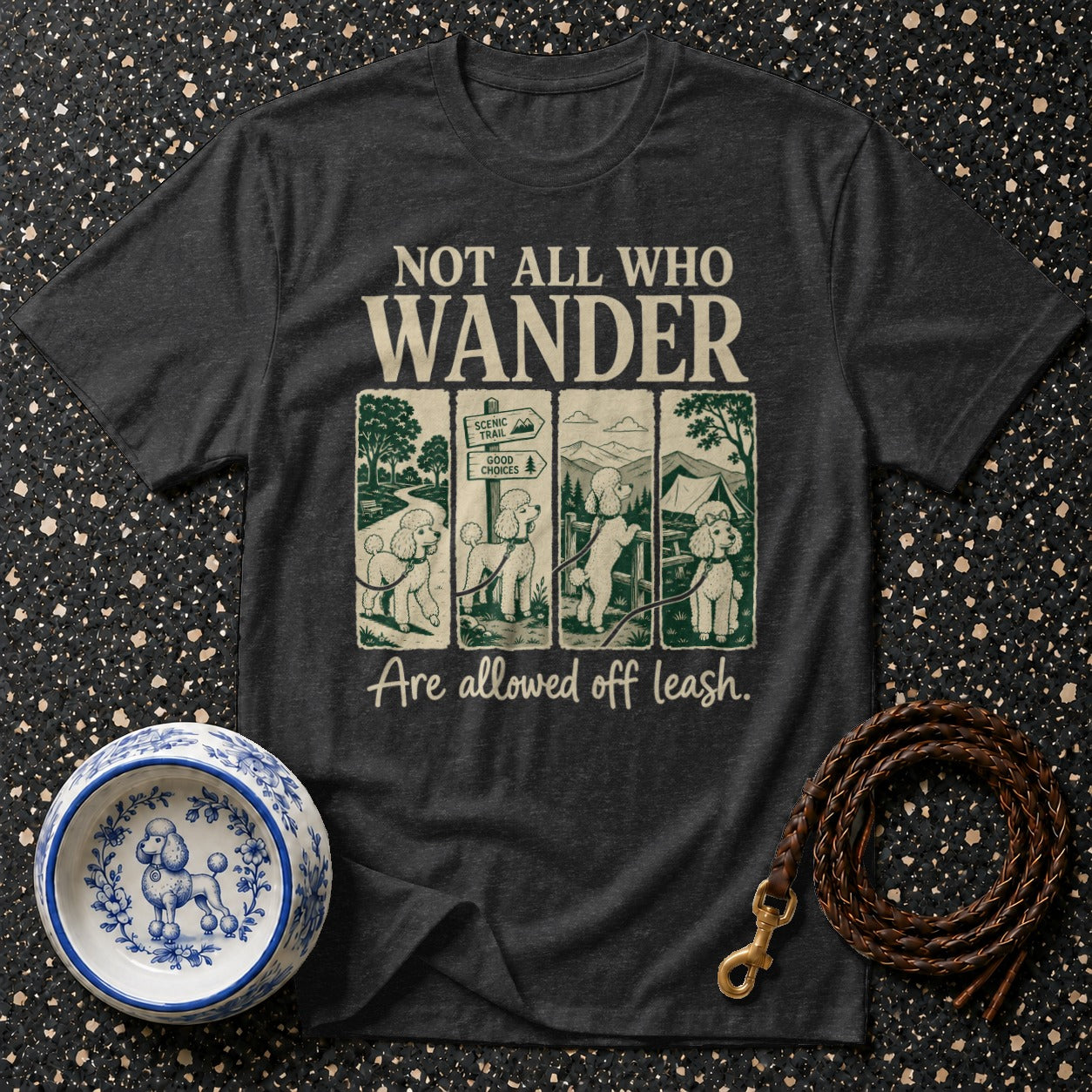 Dark t-shirt with "Not all who wander are allowed off leash" text and poodle graphics.