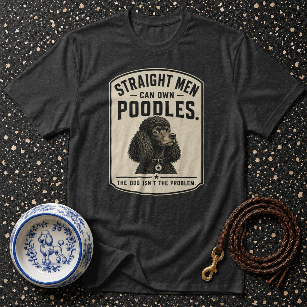 Dark grey t-shirt graphic with poodle illustration and "Straight men can own poodles. The dog isn't the problem." text.