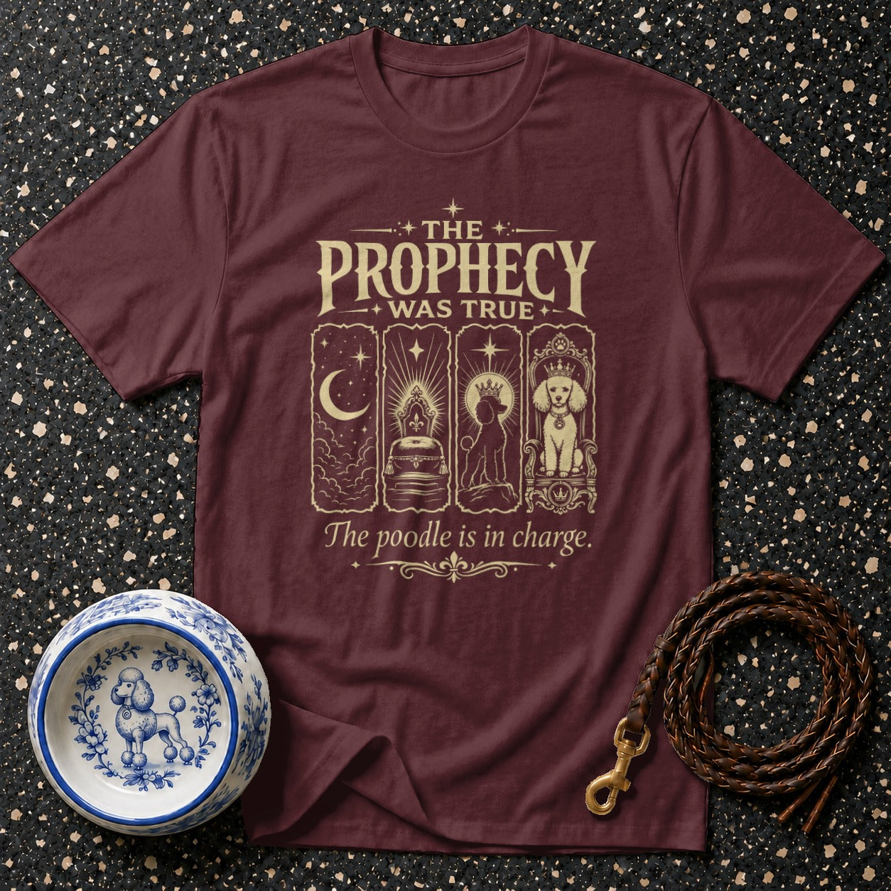 Maroon t-shirt with "The Prophecy Was True. The poodle is in charge." text and poodle imagery.