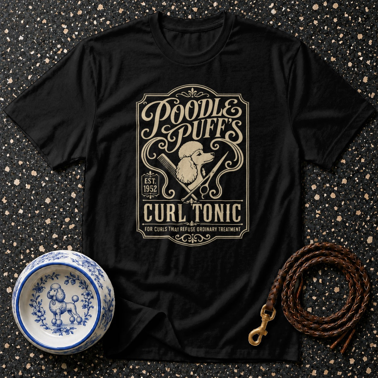 Black t-shirt with Poodle Puff's Curl Tonic graphic featuring poodle and grooming tools.