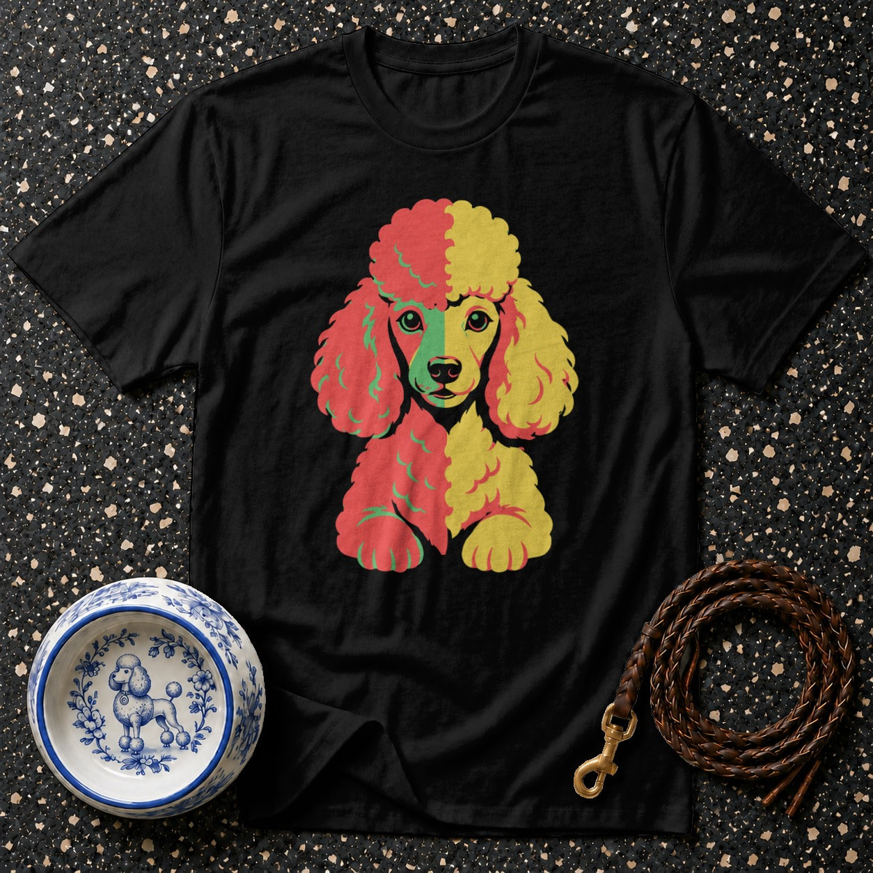 Black t-shirt featuring a colorful poodle graphic with a patterned dog bowl and leash.