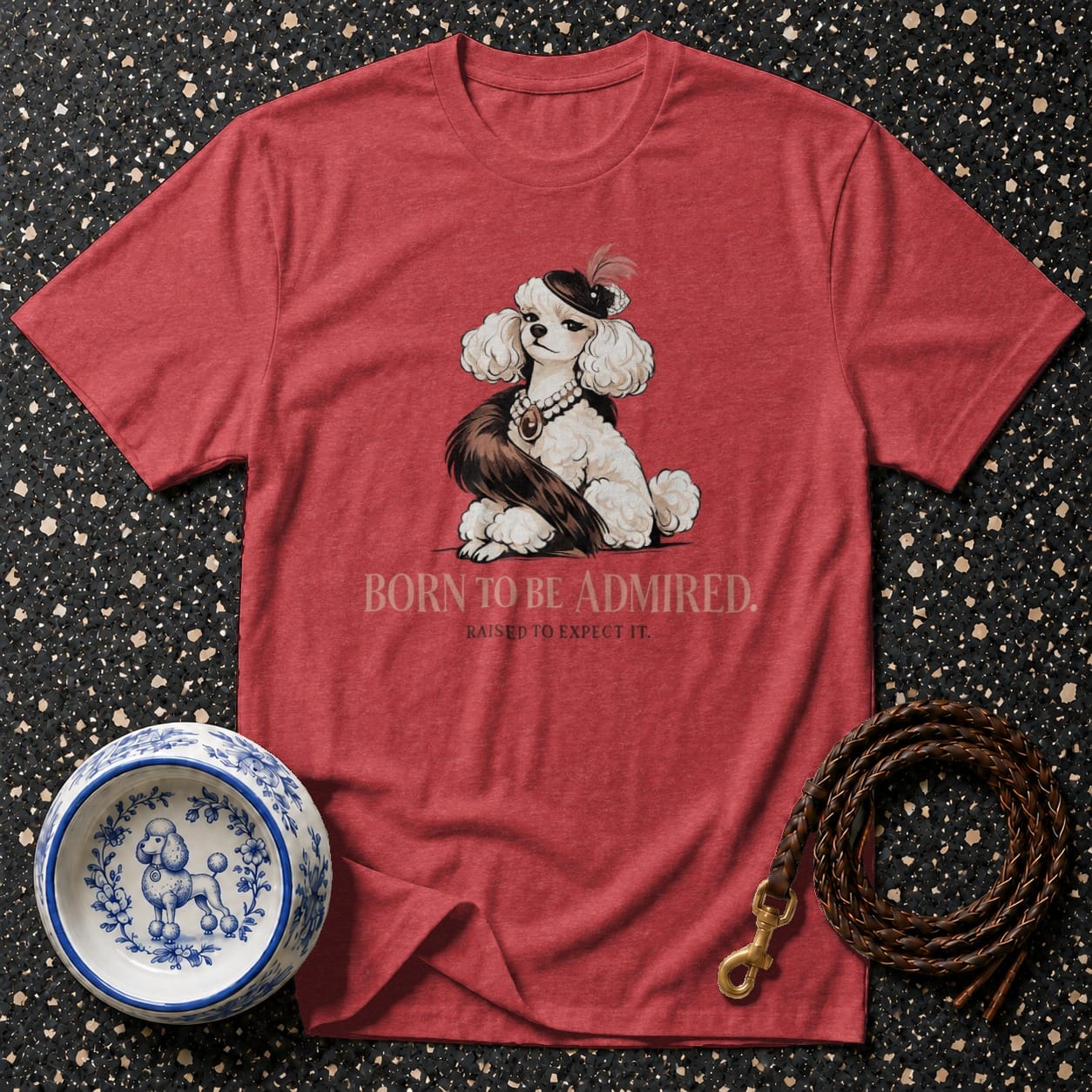 Red t-shirt with illustration of a fancy poodle and text "BORN TO BE ADMIRED."