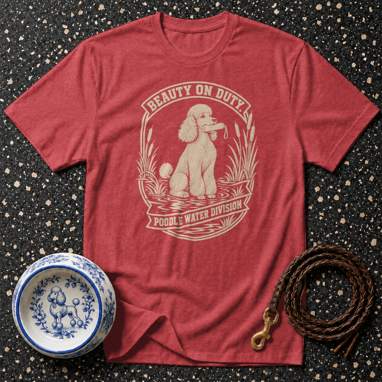 Red t-shirt with "Beauty on Duty Poodle Water Division" graphic.