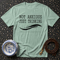 Mint t-shirt with text "NOT ANXIOUS JUST THINKING, THERE'S A LOT GOING ON BEHIND THE CURLS."