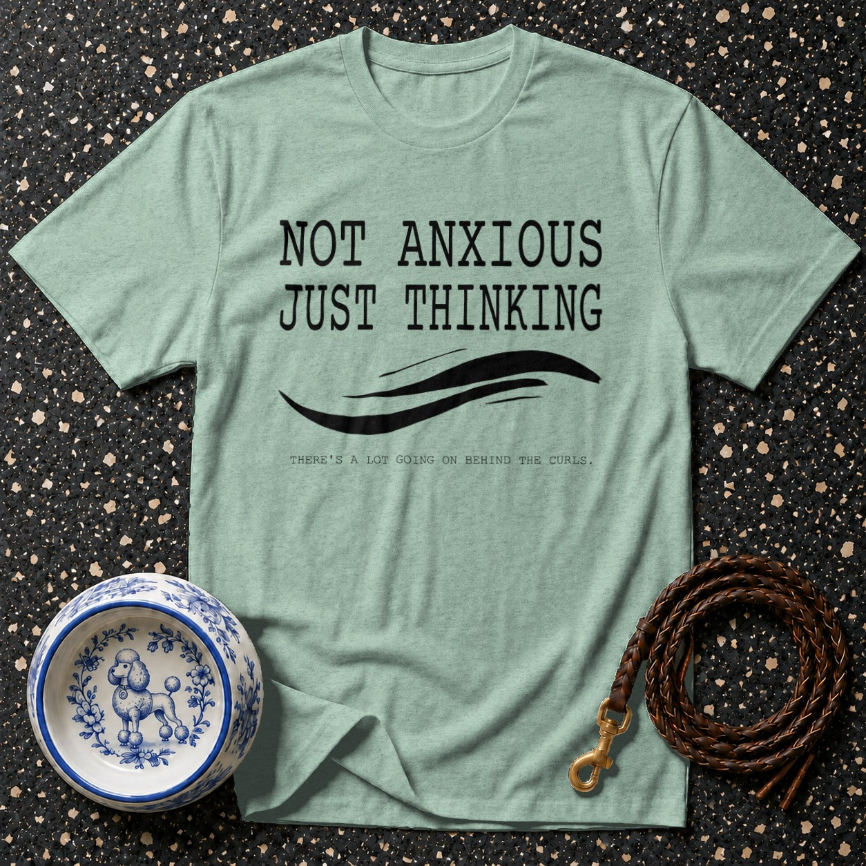 Mint t-shirt with text "NOT ANXIOUS JUST THINKING, THERE'S A LOT GOING ON BEHIND THE CURLS."