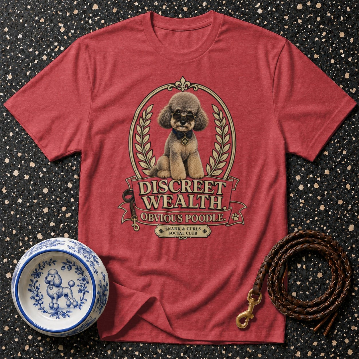 T-shirt with graphic of a poodle wearing sunglasses and text "Discreet Wealth Obvious Poodle".