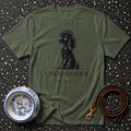 Olive t-shirt with a black poodle illustration and text "UNIMPRESSED, AS USUAL."