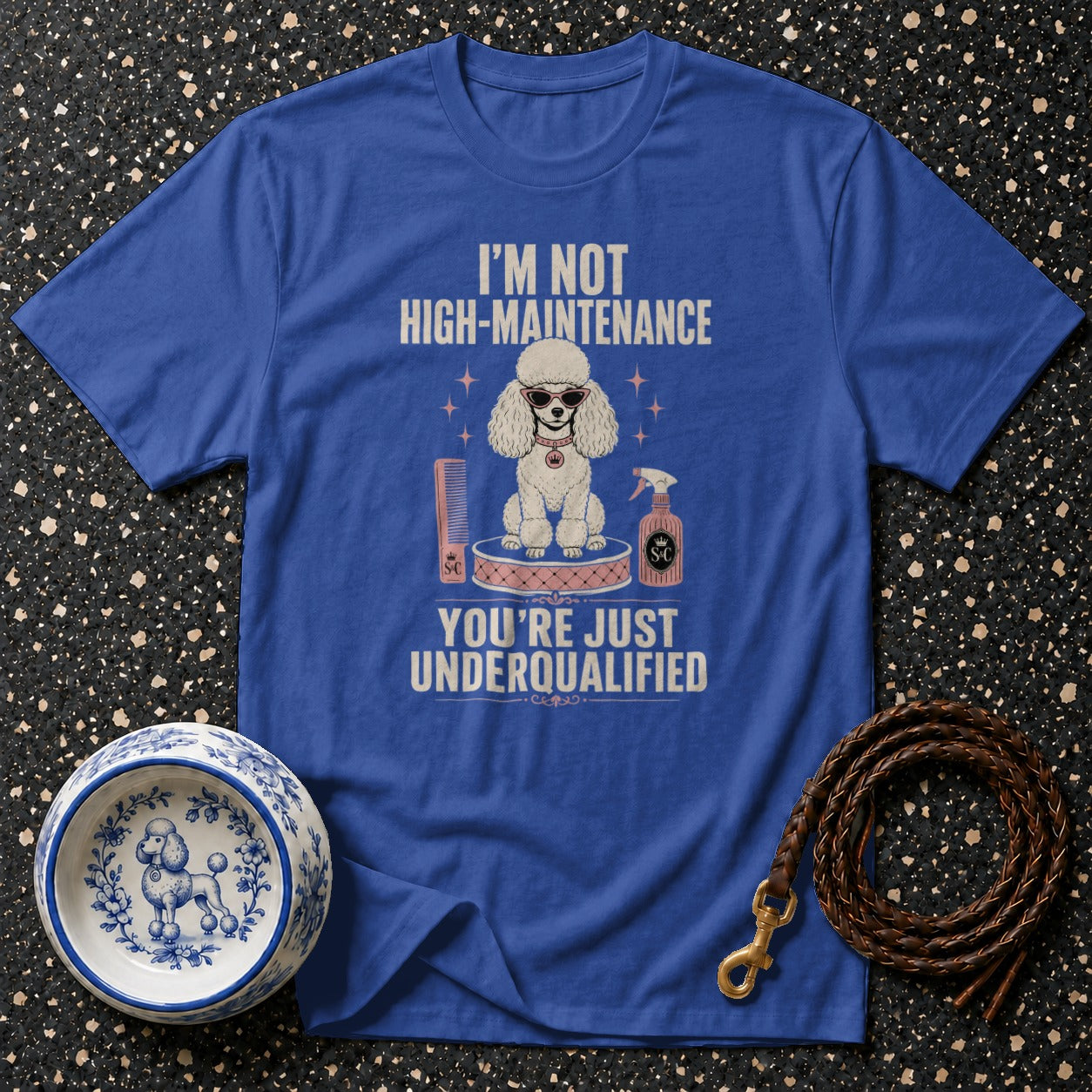 Blue t-shirt with a poodle, hairspray, and comb sporting the text "I'm Not High-Maintenance. You're Just Underqualified."