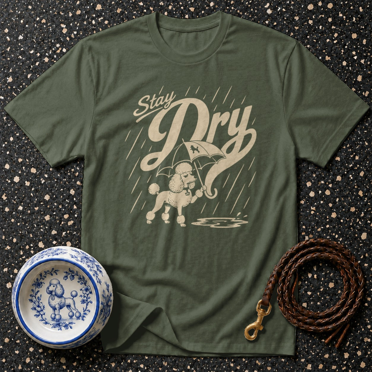 Green t-shirt with poodle under umbrella and text "Stay Dry"