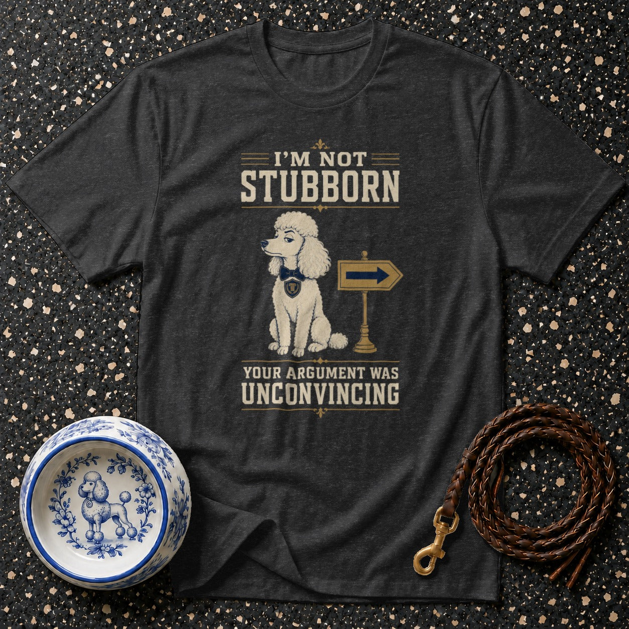 Dark t-shirt with poodle graphic and text "I'm not stubborn, your argument was unconvincing."