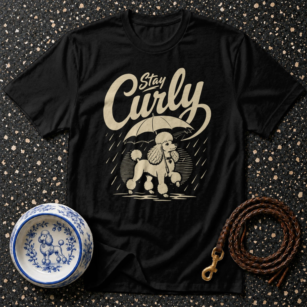 Black t-shirt with cream poodle under umbrella graphic and "Stay Curly" text.