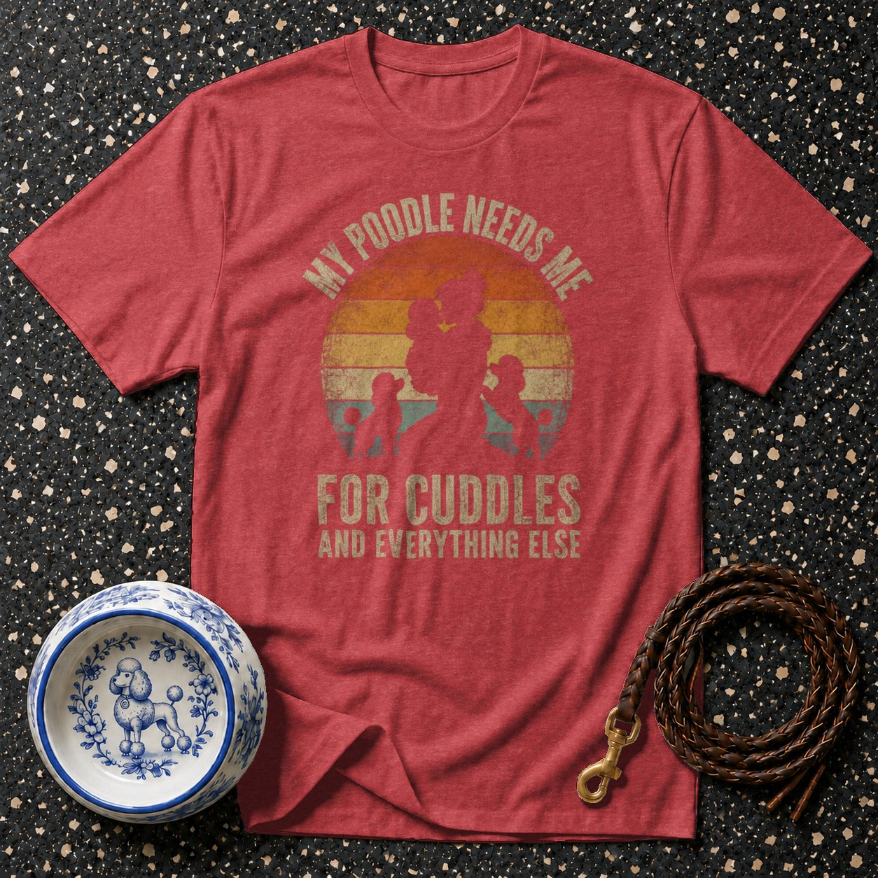 Red t-shirt with vintage "My Poodle Needs Me for Cuddles" graphic.