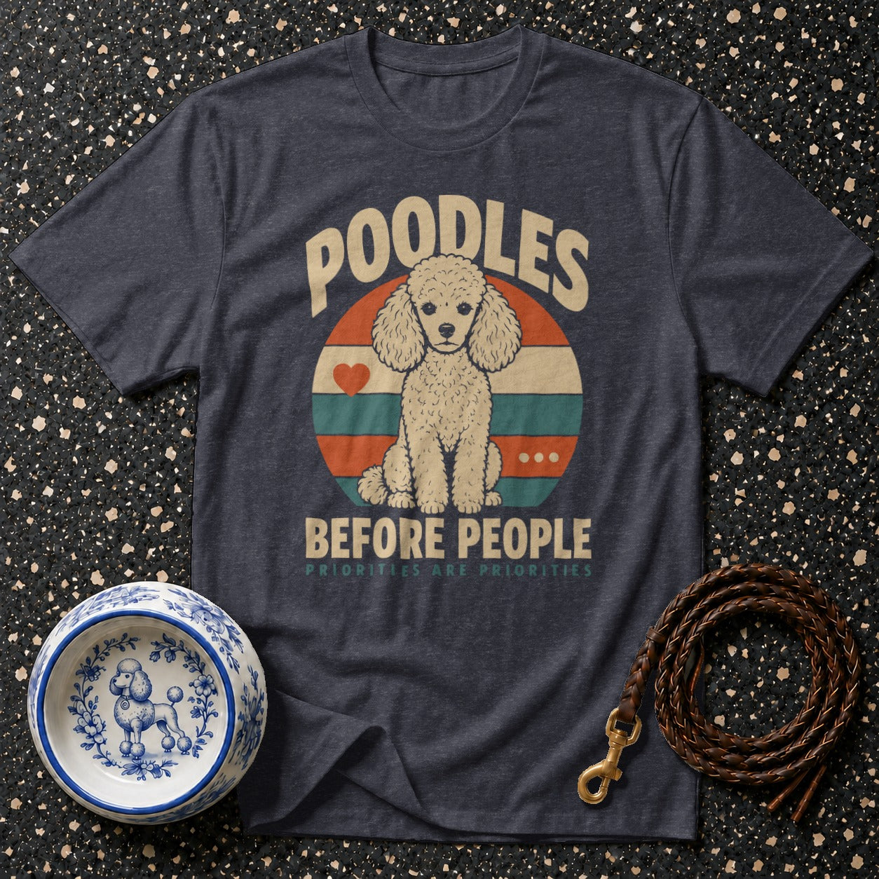 Dark blue t-shirt with a poodle graphic and the text "POODLES BEFORE PEOPLE".